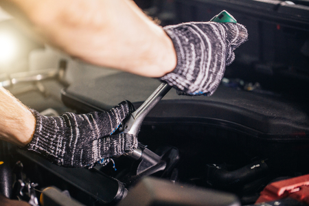 mechanic his repair shop standing near car. close-up engineの写真素材