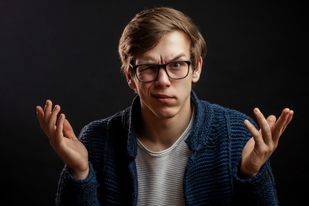 close up portrait of funny guy in glasses gesturingの写真素材