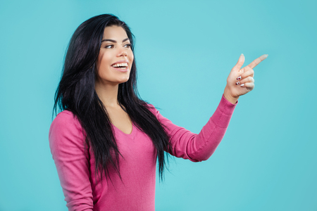 elegant woman pointing at somewhereの写真素材