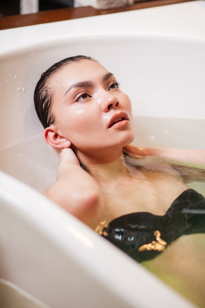 close up portrait of Asian girl in bath treatment