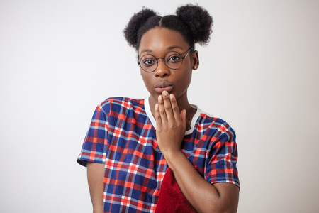 black female student going to send air kissの写真素材