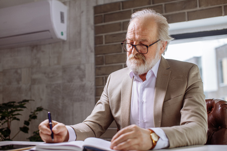 attractive pensioner with grey hair, beard and moustacheの写真素材