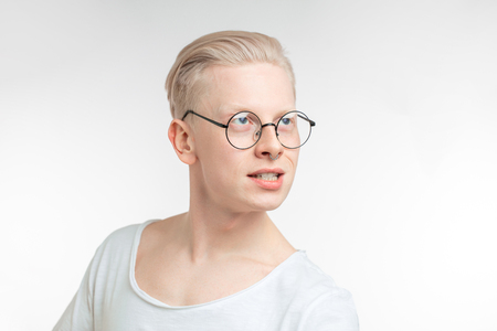 Portrait of young blonde man with healthy clean skin. Isolated on whiteの写真素材