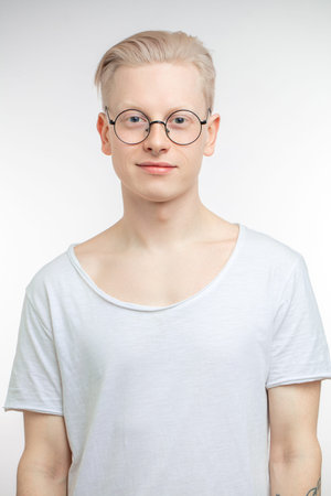 Portrait of young blonde man with healthy clean skin. Isolated on whiteの写真素材