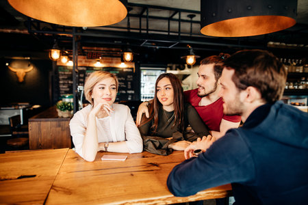 Friends Meeting in bar with loft interior