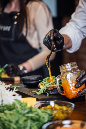 Chef making beef burgers at burger pubの写真素材