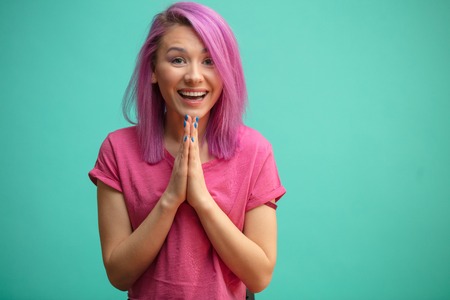 Glad adorable young woman meets and greeting her best friend.の写真素材