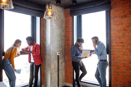 Female architect teacher helping students with project for university courseworkの写真素材