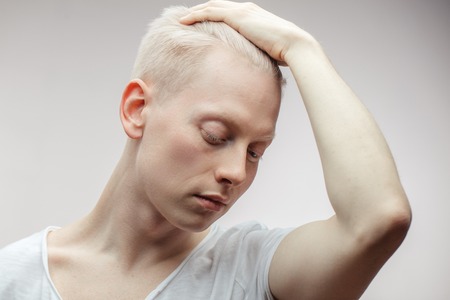 Fashion model male isolated on white. Handsome albino guy closeup.の写真素材