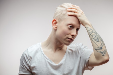 Fashion model male isolated on white. Handsome albino guy closeup.の写真素材