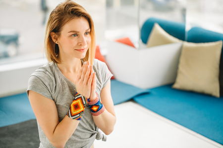 Sporty attractive woman sitting in Lotus poseの写真素材