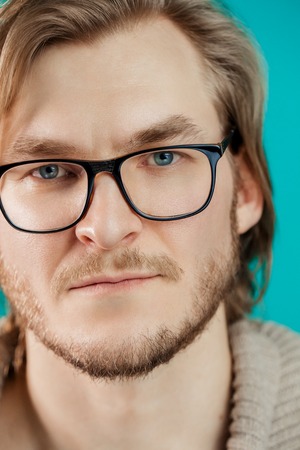 close up photo of bearded guy looking at the cameraの写真素材