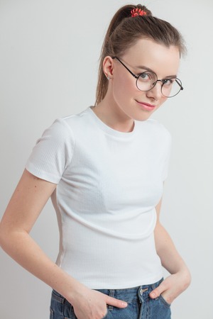 close up portrait of smiling street girl with ponytail.の写真素材