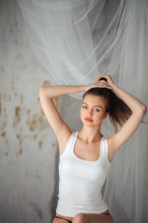 close up portrait nice woman putting her hair upの写真素材