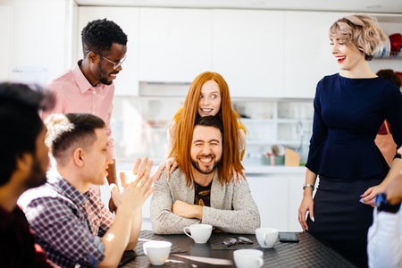 beautiful ginger woman covering the mans head by her long straight hairの写真素材