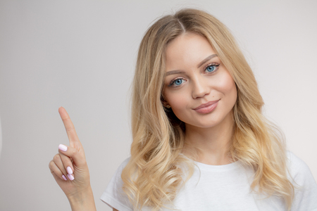 an attractive teacher giving directions to studentsの写真素材