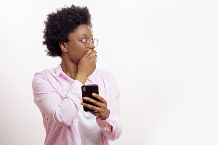 scared woman covering her mouth with a hand