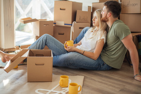Couple moving new home. Happy people buy new apartment