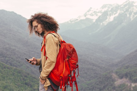 the Man Traveler with backpack hiking outdoorの写真素材