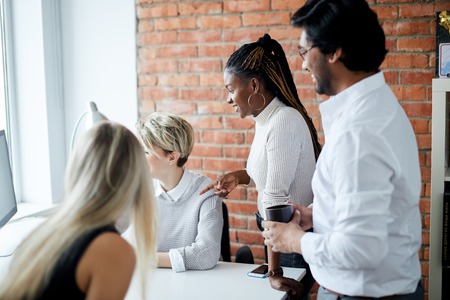 blond girl conducting a workshop using the TVの写真素材