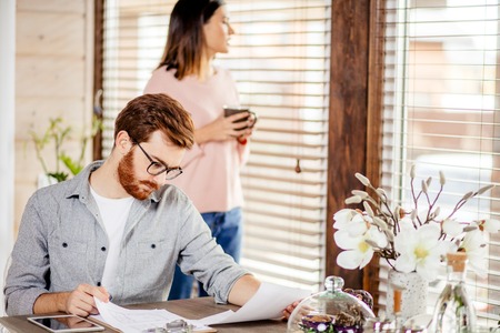 Serious applicant sitting in boardroom, preparing for interview with employer.の写真素材