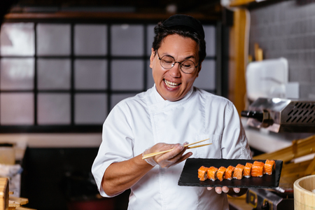 pleasant man presenting his dishの写真素材