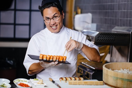 awesome male making sushi setの写真素材