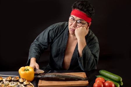 People, tiredness concept. Sad man after cooking in the kitchen. .の写真素材