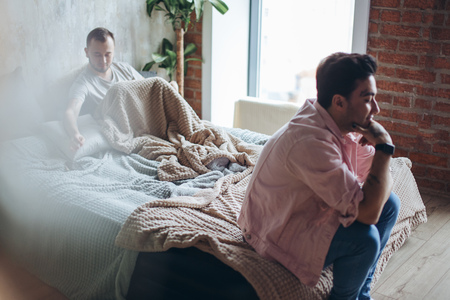 Young gay couple in quarrel at home. LGBT conceptの写真素材
