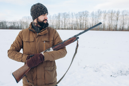 serious pensive killer with a rufleの写真素材