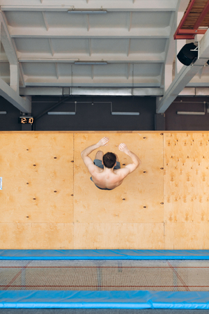 handstand. sporty guy pushing off the wallの写真素材