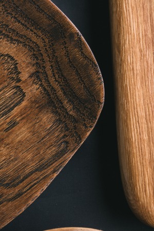 Set of wooden DIY plates, dishes, bowls and trays of different wooden texture, closeup, top view.の写真素材