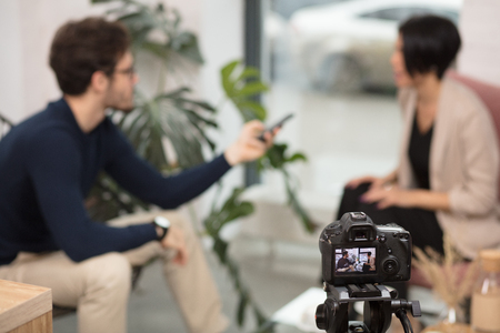 blurred background. new tecchnology. creation of a show.journalist's work.working hoursの写真素材
