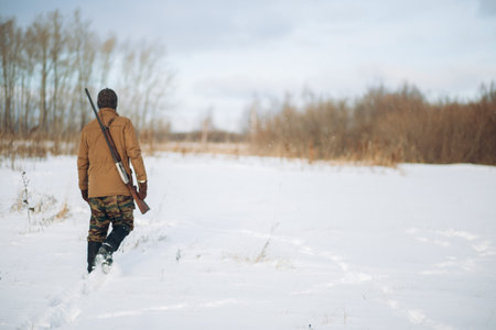 young hunter trolling in the field . full length photo. copy space. loneliness.survivor