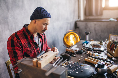 guy starts jewelry manufacturing business, close up side view photo, copy space