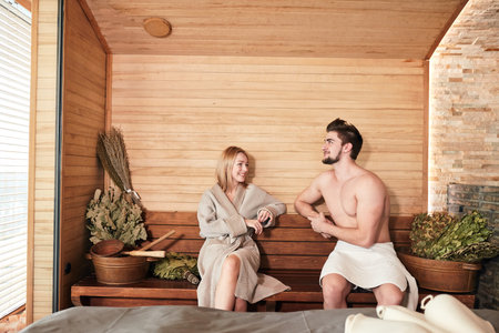 Romantic lovers having a body care day in steam bath -