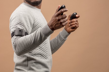 Virtual reality will also enhance surgical training, by providing students with wider range of experience and enabling quantification of their performance. Practicing student hold handheld controllerの写真素材