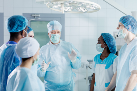 talented professional senior doctor sharing his knowledge, experience. close up photo.の写真素材