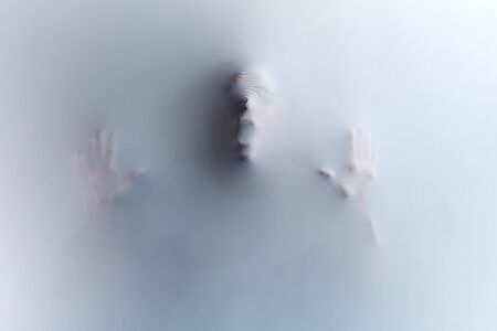 crazy mad man trying to give friends a scare, killers violence. black and white photo. phobia, fear,UFO, alien,awful death in the shower room, bathroom,a dying man gasping for breathの写真素材