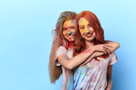 magnificent colors of joy, two positive girls embracing and looking at the camera.copy spaceの写真素材