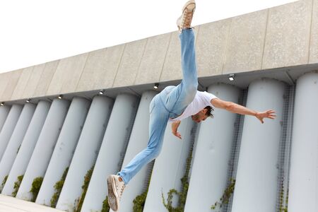 man has been got a bounce. guy has been given a hook, full length photo. student has been given the airsの写真素材