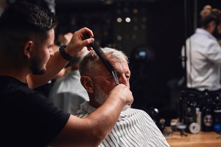 master showing master class of cutting hair, workout. close up photoの写真素材