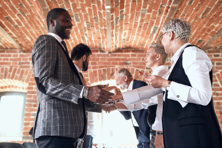Colleagues shake hands in honor of a successfully deal