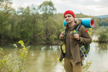handsome young traveller having a rest after long travel, hobby, interest, tourism, copy space
