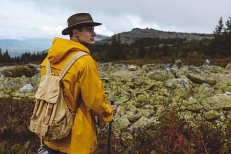 serious man trying to predict weather forecast, close up photo. copy space.travelの写真素材