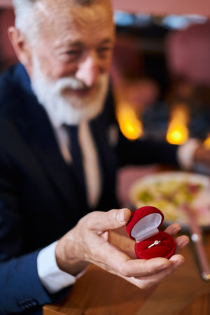 Will you marry me. Senior marriage proposal Senior man happily looks woman waiting answer marriage...