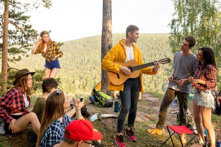 pleasant young people having fun in the fresh air, entertainment, happinessの写真素材