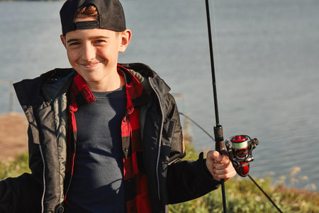 Father teach son how fishing. Teen boy happy and smile. This is first fishing with father....