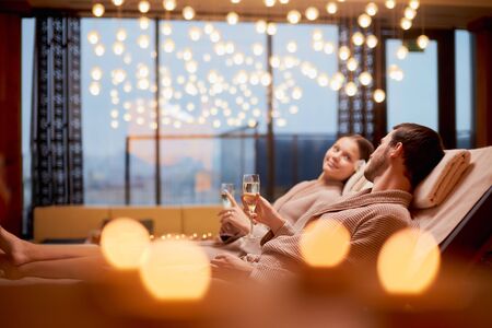 Young caucasian husband and wide take pleasure, take rest together in spa center, relax and rest of whole bodyの写真素材