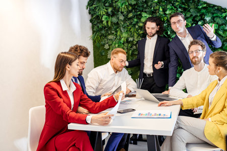 active discussion of business project in office, confident people enjoy working, cooperating together, everyone in formal wearの写真素材